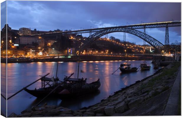 Evening at Douro River in Porto Canvas Print by Artur Bogacki