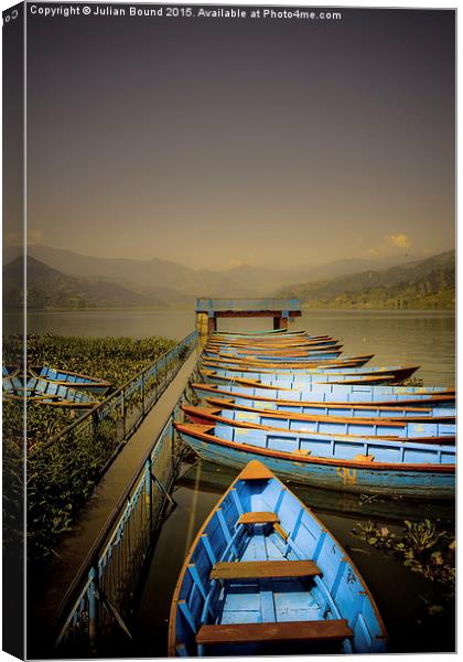Boats on Phewa Lake, Pokhara, Nepal Canvas Print by Julian Bound