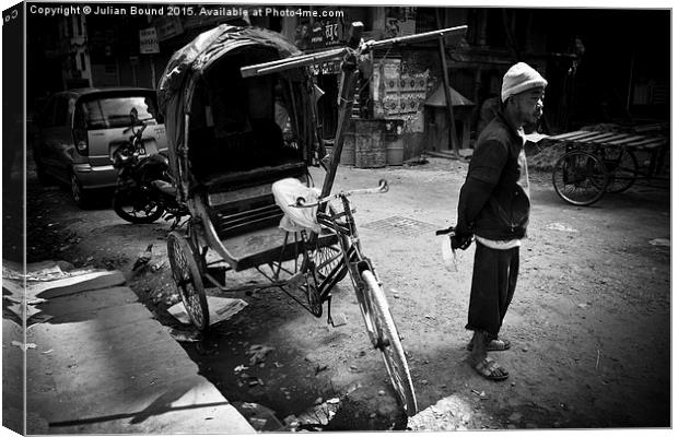   Rickshaw driver, Kathmandu, Nepal Canvas Print by Julian Bound