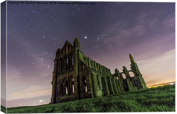  Whitby Abbey at Night Under the Stars Canvas Print by Stephen Beardon