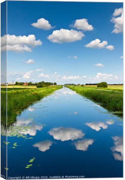 Fluffy white clouds Canvas Print by Bill Allsopp