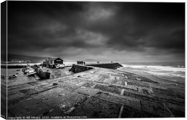 Storm clouds over The Cobb. Canvas Print by Bill Allsopp