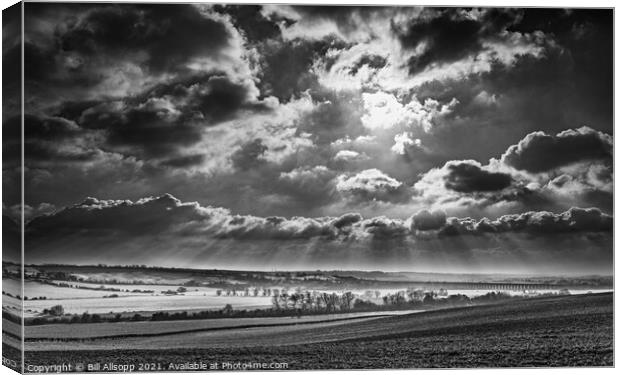 Sunbeams over the valley. Canvas Print by Bill Allsopp