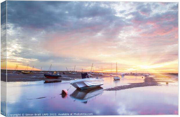 Brancaster Staithe boat harbour at sunrise in Norfolk UK Canvas Print by Simon Bratt LRPS