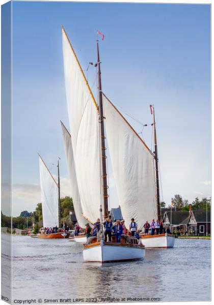 Four Wherry sail boats sailing the Norfolk Broads UK Canvas Print by Simon Bratt LRPS