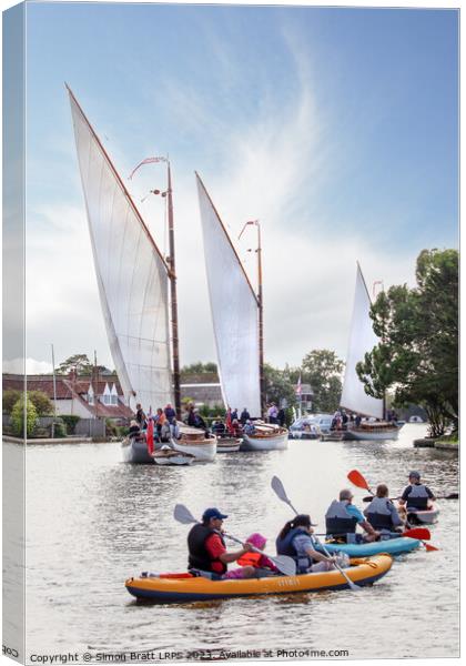 Wherry sail boats and canoes on the Norfolk Broads UK Canvas Print by Simon Bratt LRPS