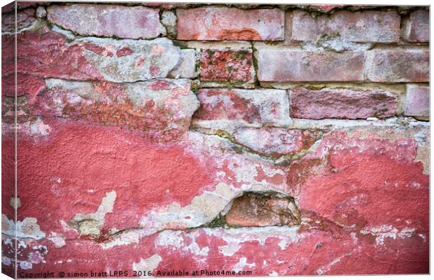 Grunge red wall with broken plaster close up Canvas Print by Simon Bratt LRPS