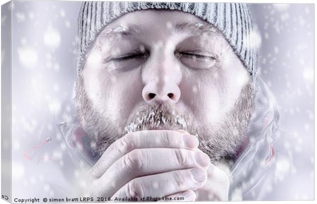 Man freezing in snow storm white out close up Canvas Print by Simon Bratt LRPS