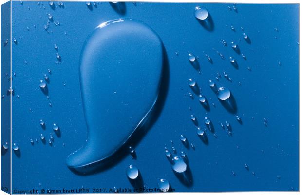 Large and small water droplets viewed from above Canvas Print by Simon Bratt LRPS