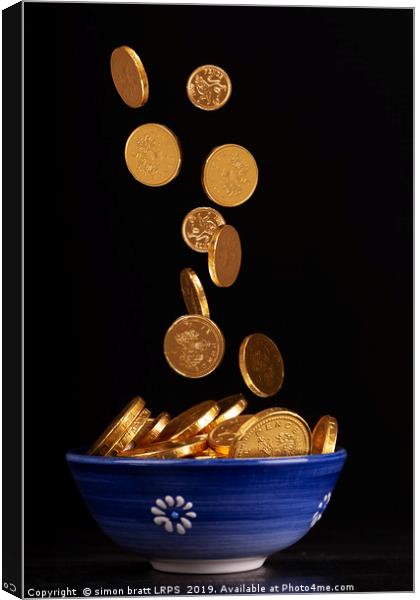 Pot of gold with blurred falling coins Canvas Print by Simon Bratt LRPS
