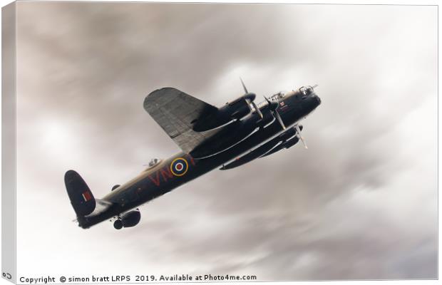 Lancaster bomber close up fly past Canvas Print by Simon Bratt LRPS