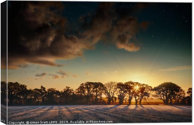 Sunrise over frosty fields in Norfolk Canvas Print by Simon Bratt LRPS