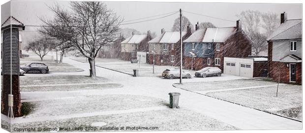 Snow blizzard street scene in rural Norfolk Canvas Print by Simon Bratt LRPS