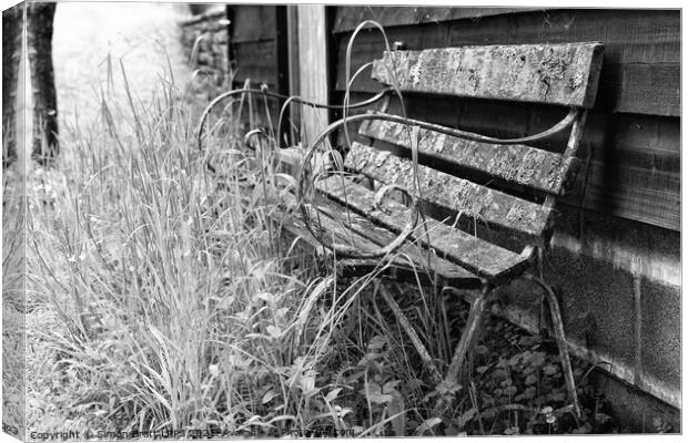 Old garden bench decaying mono Canvas Print by Simon Bratt LRPS