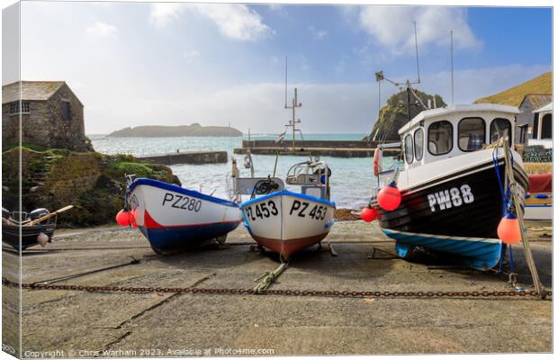 Fishing Boats in Mullion Cove pulled onto the slipway to avoid a storm . Canvas Print by Chris Warham