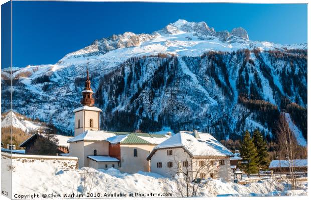 Argentiere village and church in winter.  Canvas Print by Chris Warham