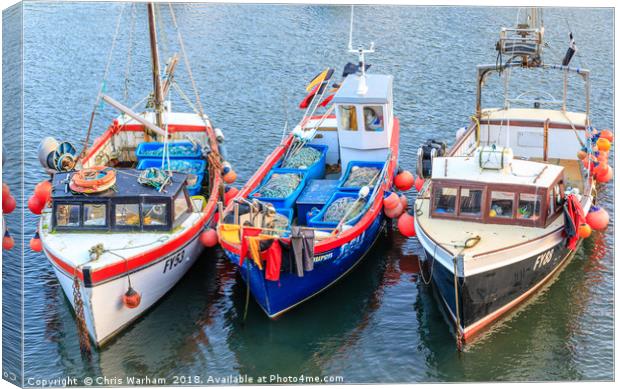 Fishing boats moored in Mevagissey harbour in Corn Canvas Print by Chris Warham