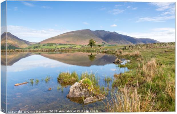 Blencathra reflections in Tewet Tarn Canvas Print by Chris Warham