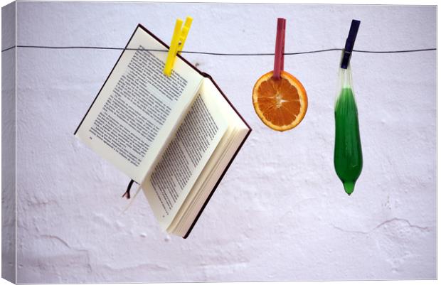 This is a still lfe made with an orange, a book an Canvas Print by Jose Manuel Espigares Garc