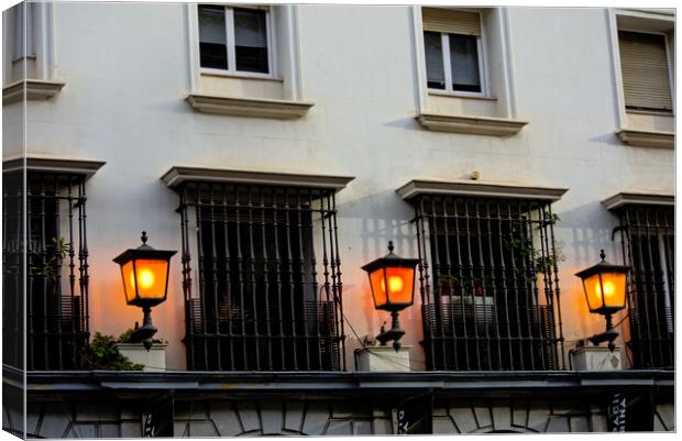 Three lamps by windows in Seville Canvas Print by Jose Manuel Espigares Garc