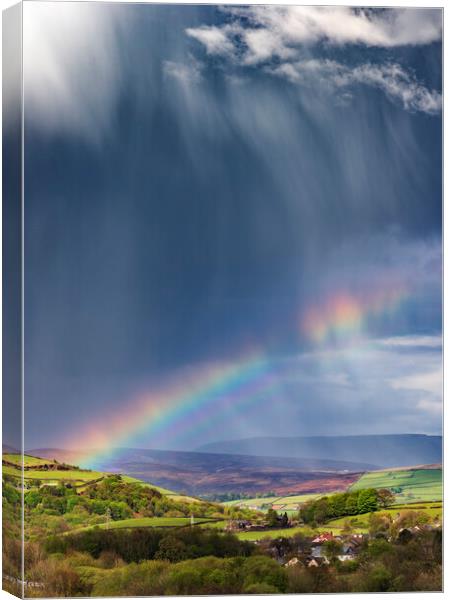 Dramatic skies over Derbyshire with double rainbow Canvas Print by John Finney