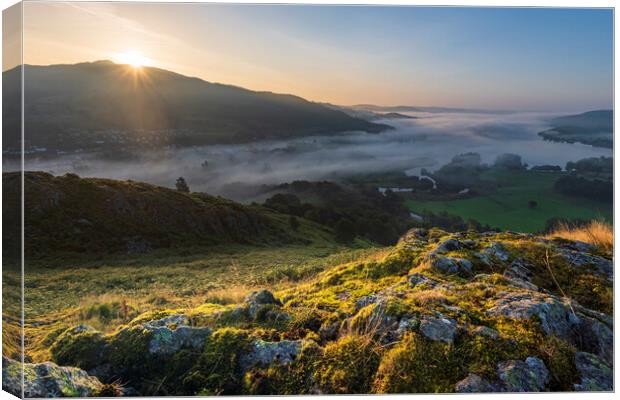 Sunrise over Wansfell Pike next to Lake Windermere Canvas Print by John Finney