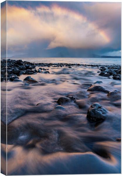 Sunrise Rainbow on Eigg Canvas Print by John Finney