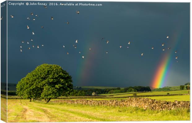 Monyash rainbow, Derbyshire. Canvas Print by John Finney