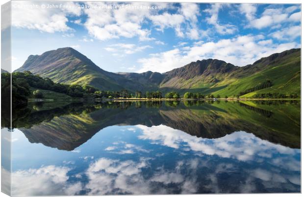 Buttermere symmetry. Lake District. England. Canvas Print by John Finney
