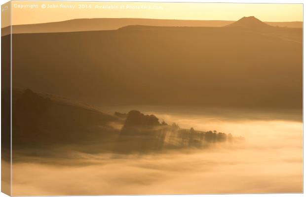 Winhill over a golden misty Hope valley at sunrise Canvas Print by John Finney