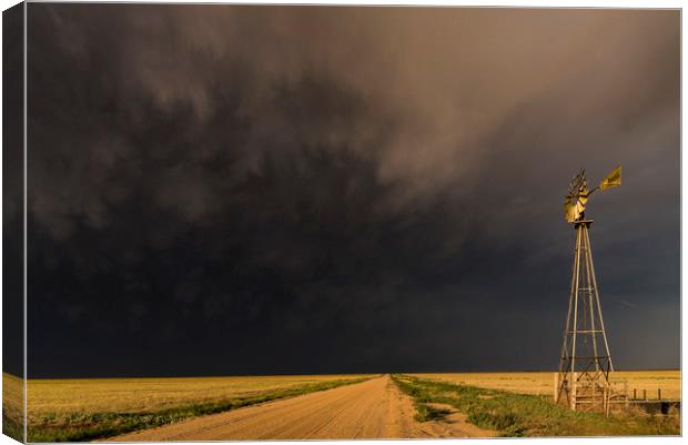 The Storm and a Windmill Canvas Print by John Finney