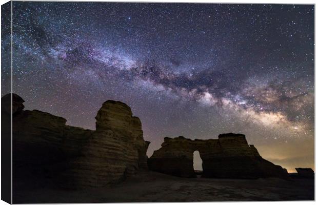 Monument Rocks and the Milkyway Canvas Print by John Finney