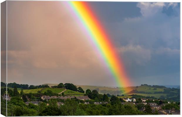 Rainbow over New Mills, Derbyshire Canvas Print by John Finney