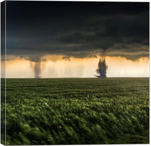 Sister Tornadoes in a Ferocious Storm Canvas Print by John Finney