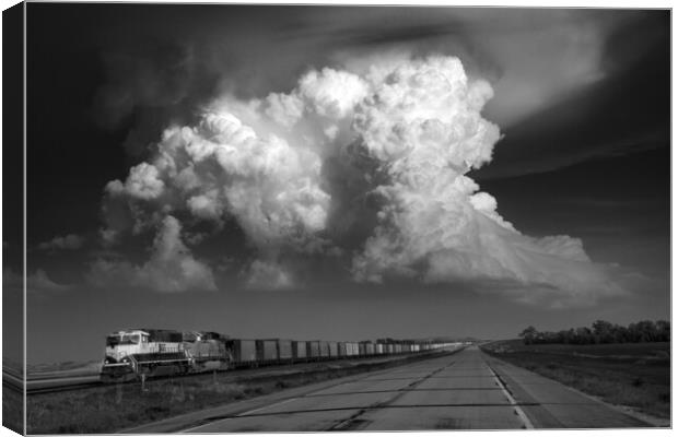 Storm over Freight train, Tornado alley, USA. Canvas Print by John Finney