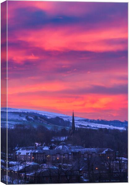 Red sky over New Mills St George's Church Canvas Print by John Finney