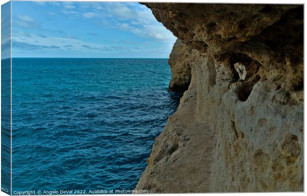 Exploring the Cliffs in Carvalho Beach. Algarve Canvas Print by Angelo DeVal