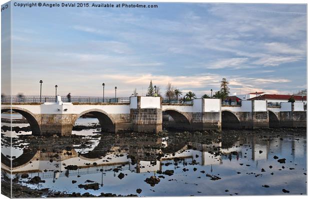 Antique bridge of Tavira and reflections Canvas Print by Angelo DeVal
