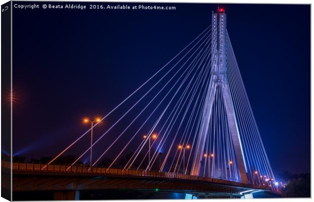 Swietokrzysk bridge in Warsaw at night Canvas Print by Beata Aldridge