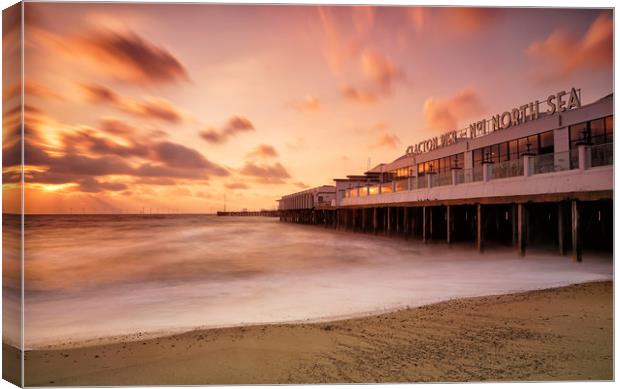 Clacton on Sea Pier at sunrise Canvas Print by Rob Woolf