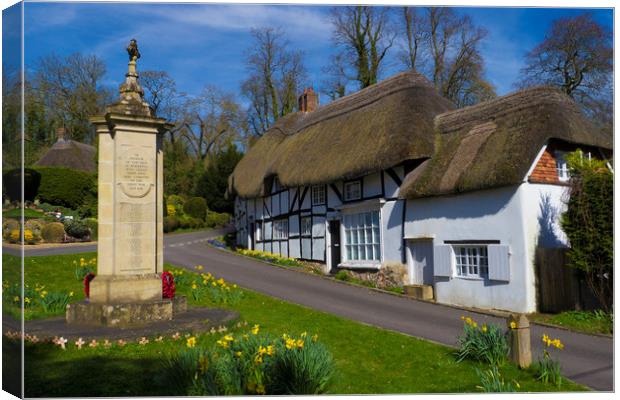 Thatched Cottage and War Memorial Wherwell,Hampshi Canvas Print by Philip Enticknap