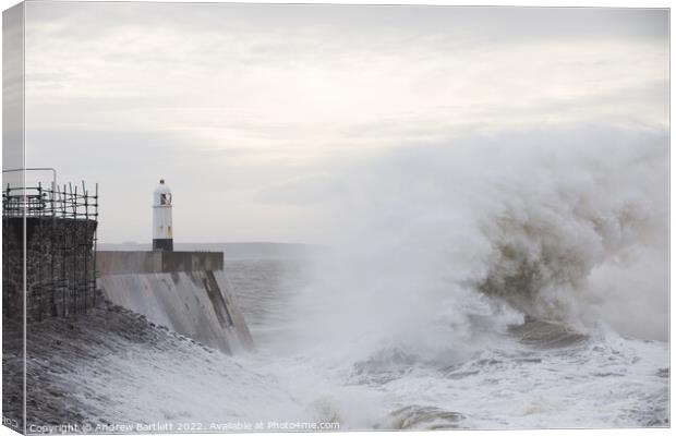 Large waves crash near Porthcawl lighthouse Canvas Print by Andrew Bartlett