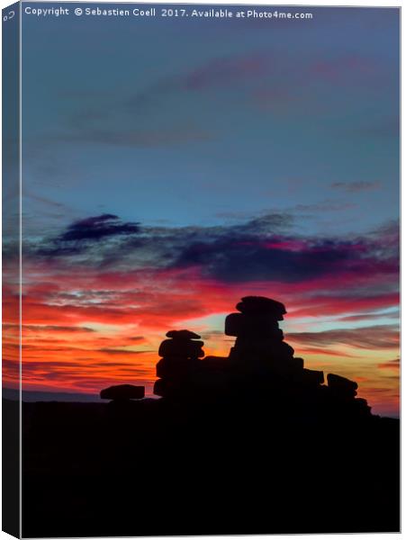 The redsky dances above great staple tor on Dartmo Canvas Print by Sebastien Coell