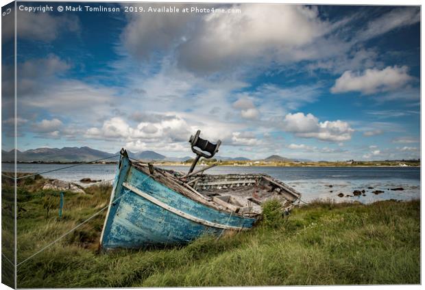 Weathered Boat on the Irish Coast Canvas Print by Mark Tomlinson