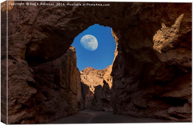Moon Through Rock Arch Canvas Print by Reg K Atkinson