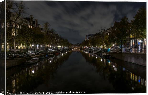 Amsterdam central canal at night  Canvas Print by Steven Blanchard