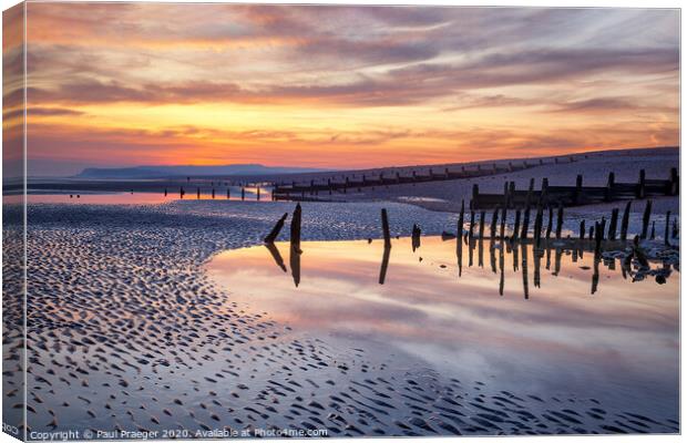 Sunset reflections at low tide Canvas Print by Paul Praeger