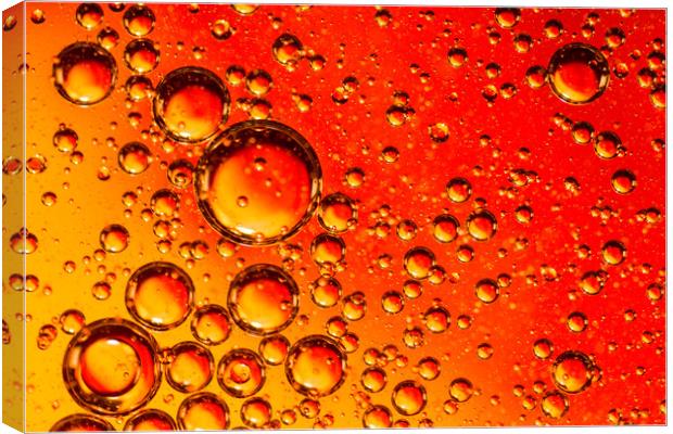 Red and Orange Coloured Oil on Water Abstract Canvas Print by John Williams