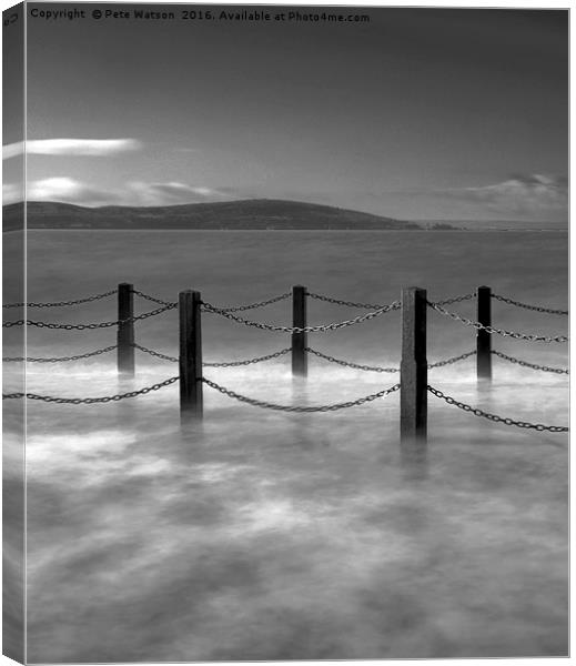Waves and safety fence on the causeway Canvas Print by Pete Watson