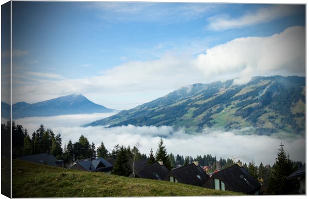 Switzerland Mountains with low cloud Canvas Print by Darren Willmin